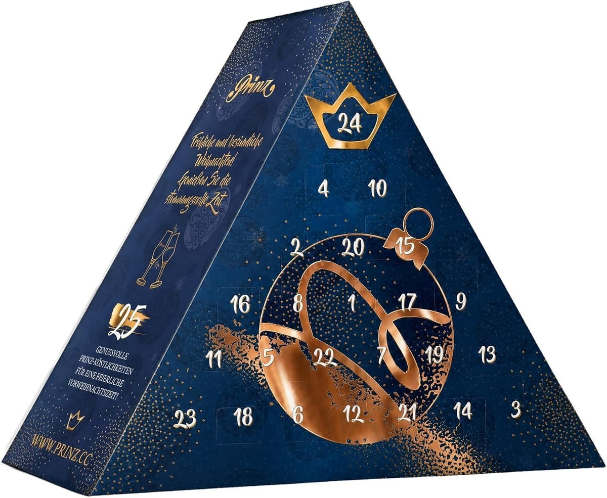 Prinz adventskalender koningsblauw: driehoekige blauwe doos met koperkleurige kerstbal en een gouden kroon boven vakje 24