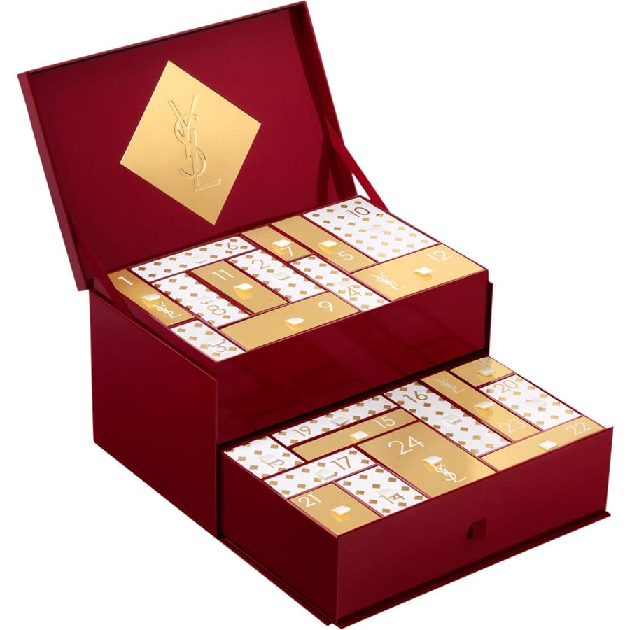 Geopende Yves Saint Laurent adventskalender in bordeauxrood met een la en wit-gouden vakjes